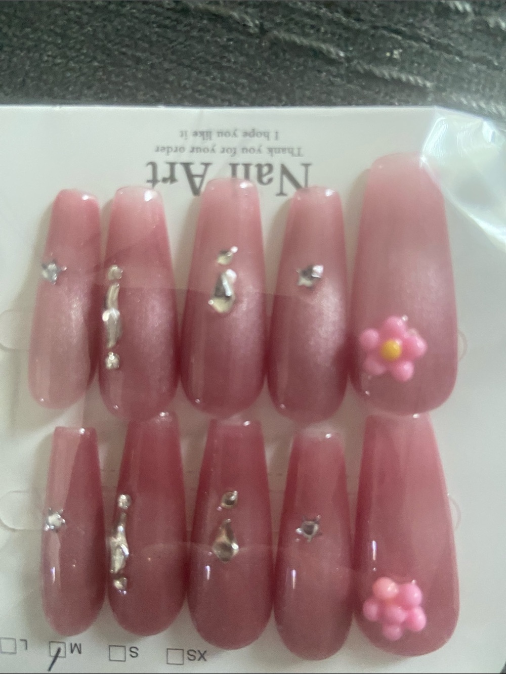 New set of pink cat eye nails with gems